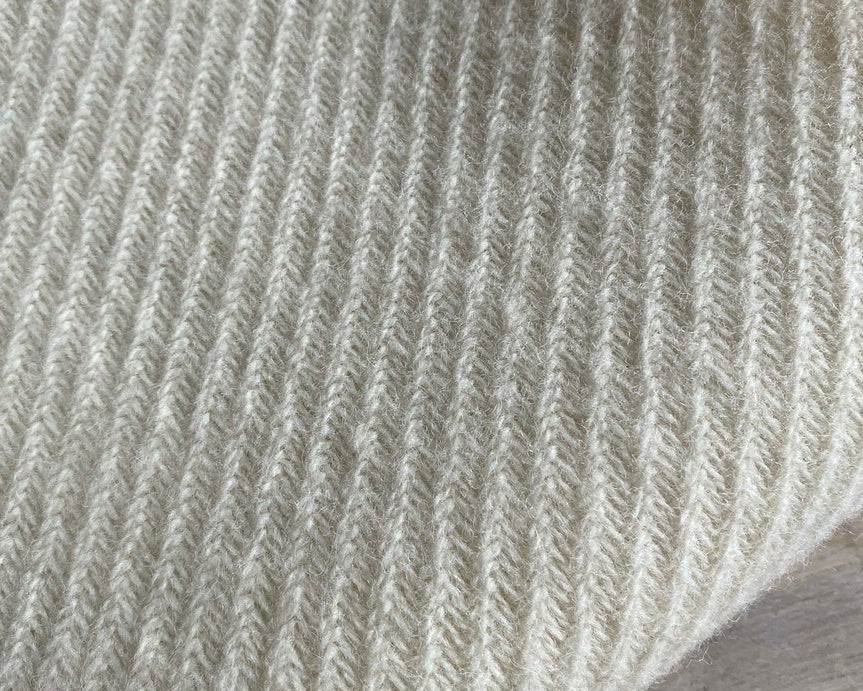 Wollen wiegendeken creme