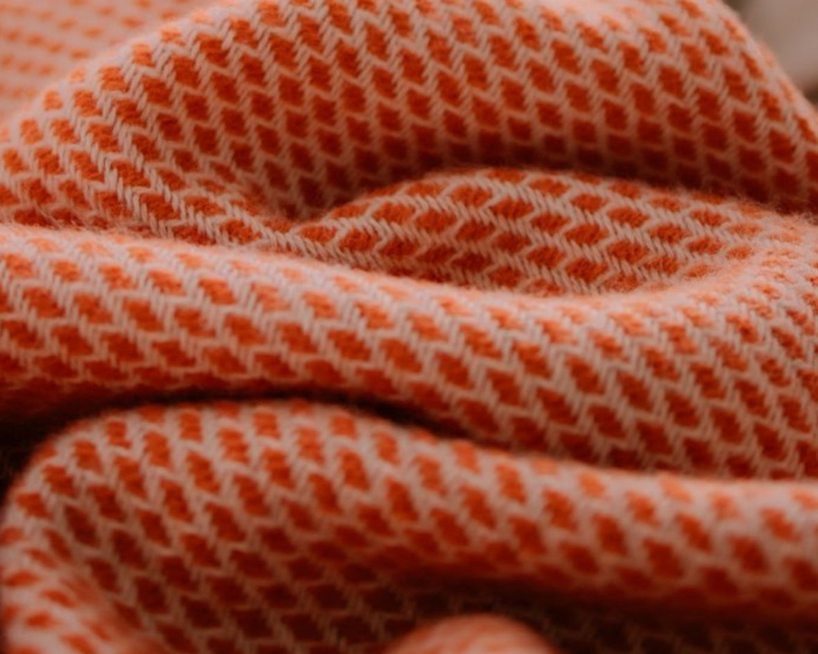 Wollen wiegendeken in retro oranje