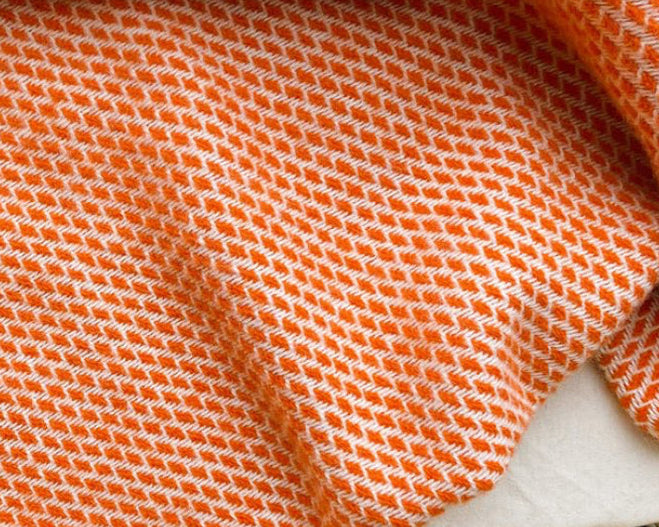 wollen wiegen deken in de kleur retro oranje