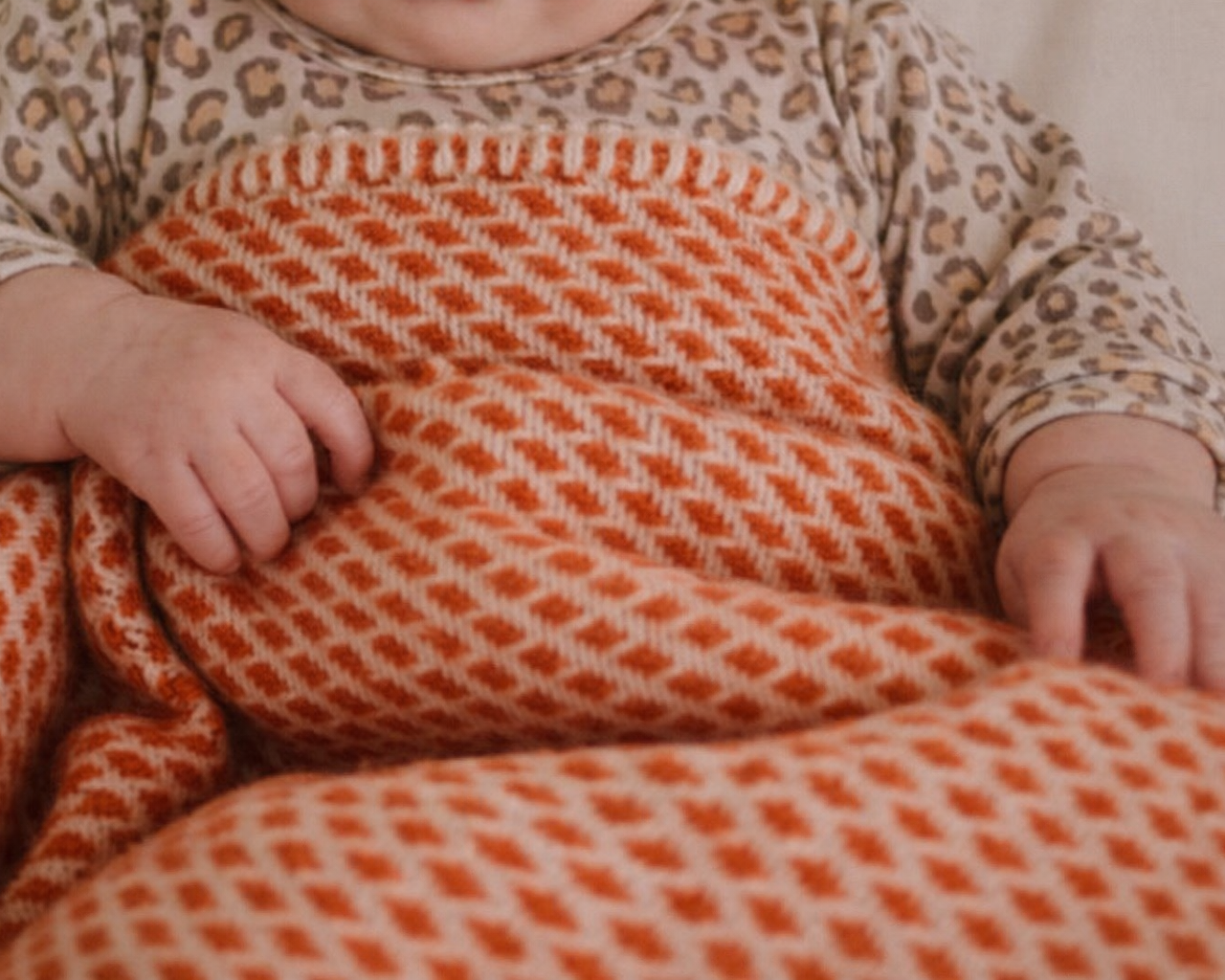 Wollenwiegen deken in oranje