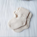 Baby booties & hat | 
 Cream
